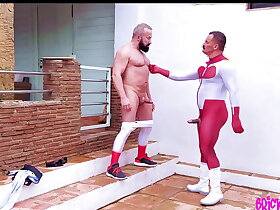 Omniman gets a delivery from a spandex clad muscle man